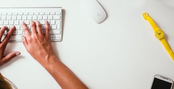 hand typing on keyboard