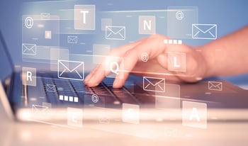 Hand on a laptop keyboard