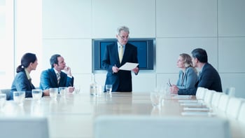 People sitting around a table for an institutional investor meeting