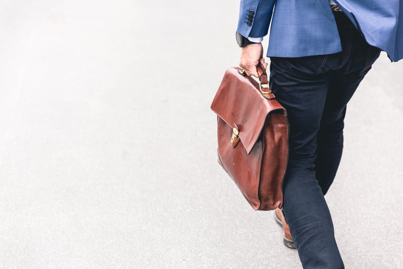 Business man walking with briefcase
