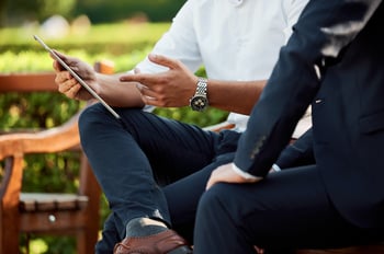 men looking at tablet