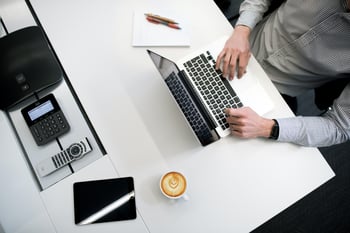 man working at a laptop computer