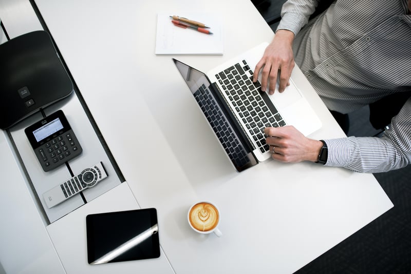 man working at a laptop computer
